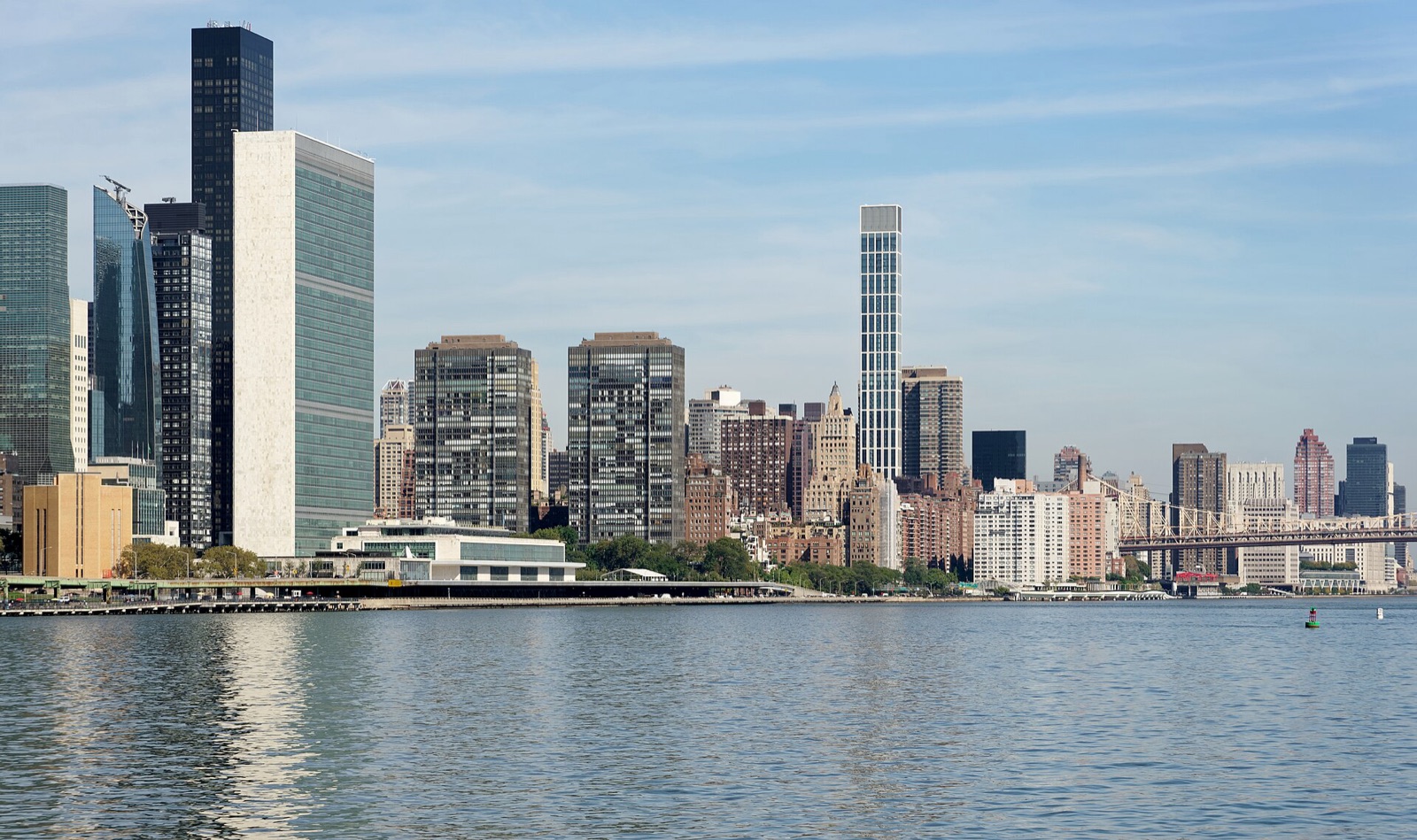 The United Nations Headquarters tower and the Manhattan skyline across the East River in New York